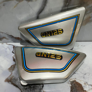 TAPAS LATERALES GN125